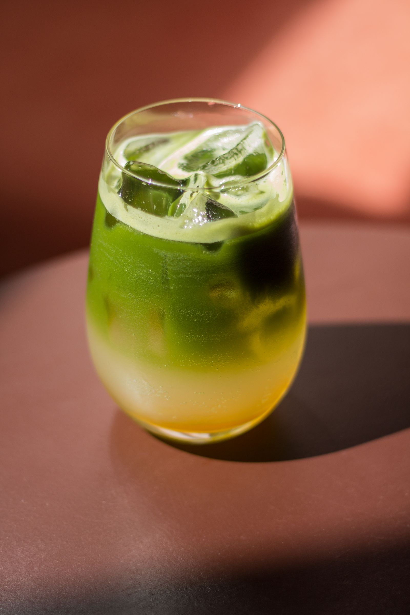Iced matcha latte with vibrant green layers